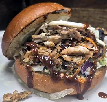 Pulled smoked chicken burger with BBQ sauce